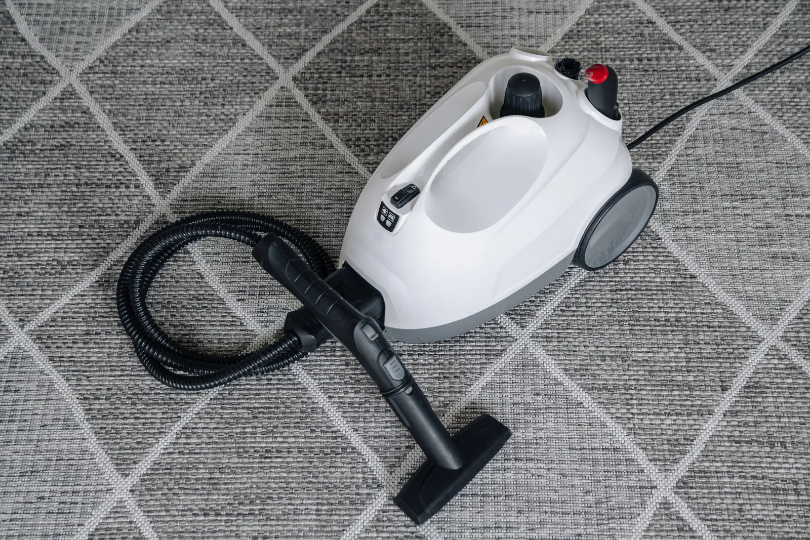 Carpet cleaning Adelaide: steam cleaner machine on a patterned rug